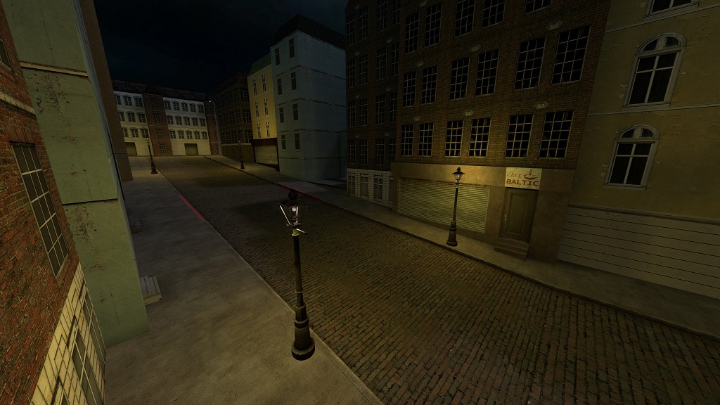 Angled shot of a dark city street going up hill, with yellow gothic street lights